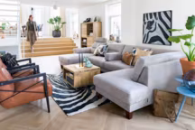 Canapé d'angle Palio, composeÌ d'un eÌleÌment 2 places sans accoudoir avec ottomane et meÌridienne en tissu, aÌ€ partir de 2349 euros ; bout de canapé 60 x 60 cm, 429 euros ; fauteuil Northon en tissu à partir de 649 euros, H&H.