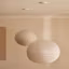 Inspiré des lanternes japonaises traditionnelles, ce double plafonnier apporte douceur et sérénité à n'importe quelle salle à manger