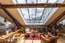 15 appartements sublimés par des poutres en bois apparentes.